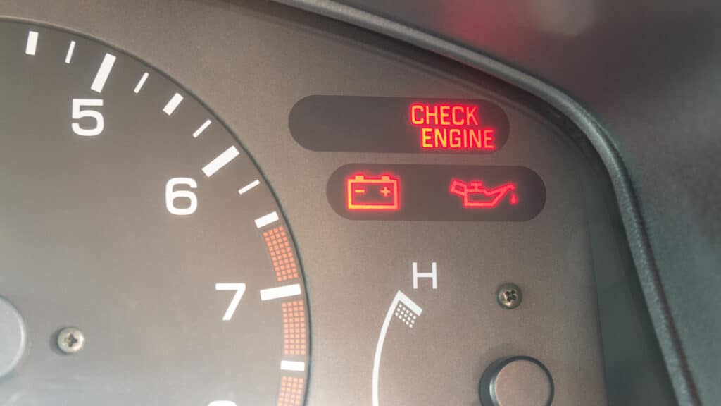 Check Engine Light | EG Auto Center in Dayton, NJ. Image of an illuminated check engine light on a car dashboard.